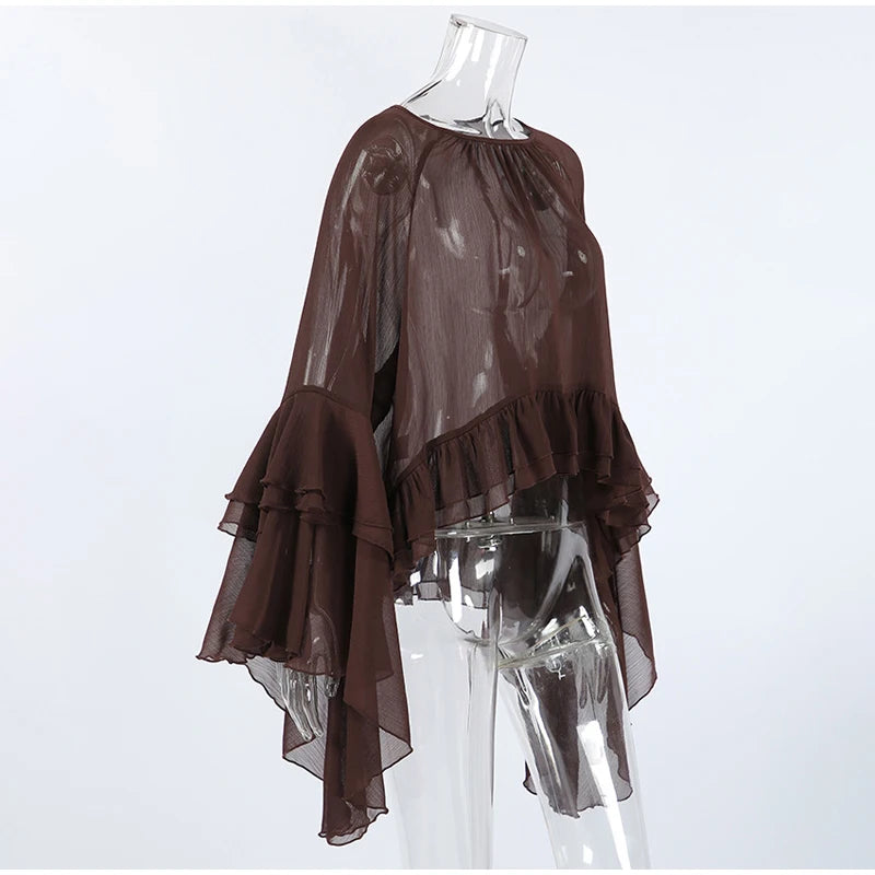 Brown sheer blouse on a clear mannequin against a white background