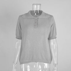 Gray short-sleeve top on a mannequin against a gray background