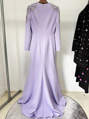 Lavender evening gown with beaded shoulders on a hanger against a white background