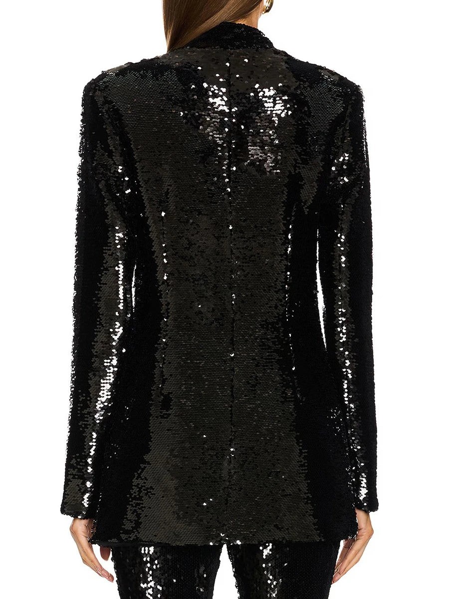 Black sequin blazer worn by a person on a white background