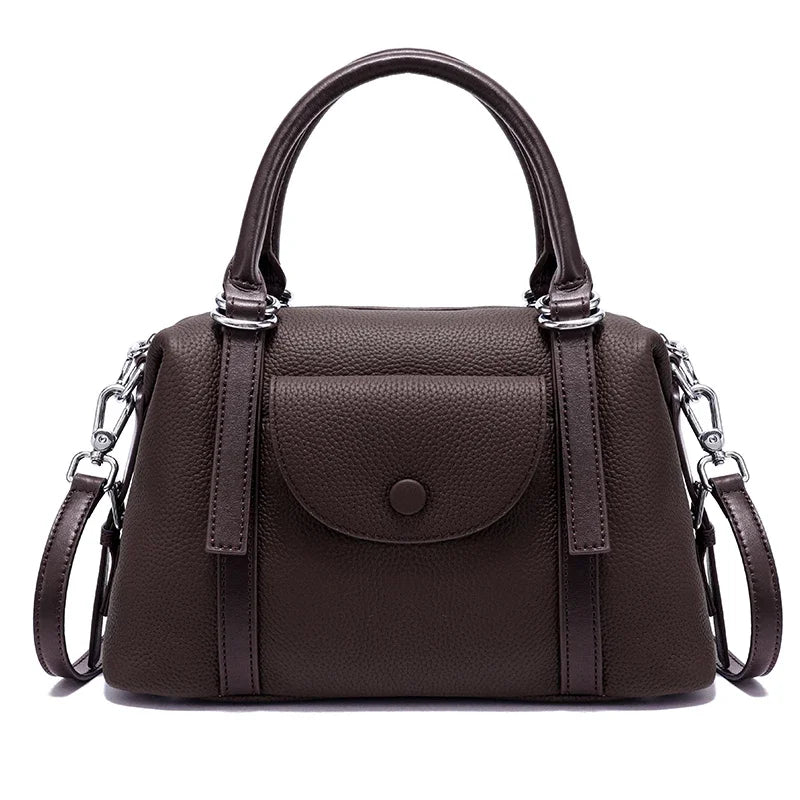 Brown handbag with a shoulder strap on a white background