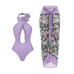 Lavender floral one-piece swimsuit and matching cover-up skirt.