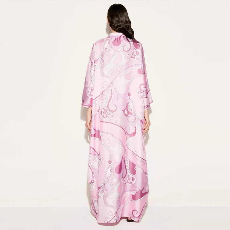 Woman wearing a pink floral dress on a white background