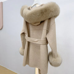 Beige coat with fur hood and cuffs on a white background