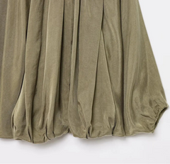 Green blouse with balloon sleeves on a white background