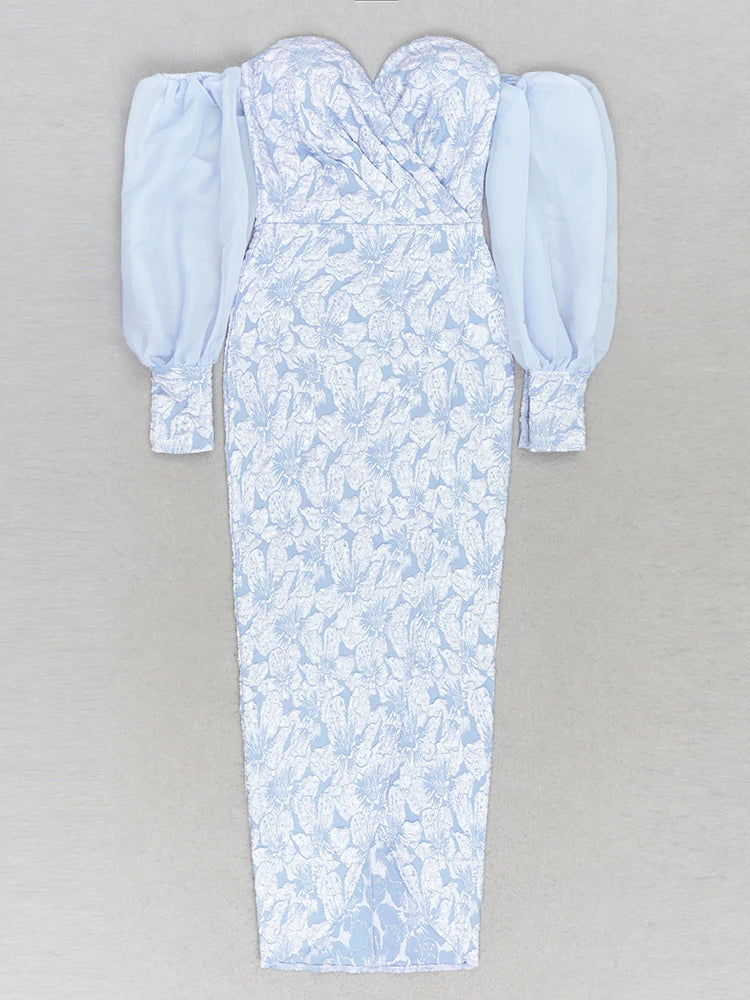 Light blue floral dress with puffed sleeves on a gray background