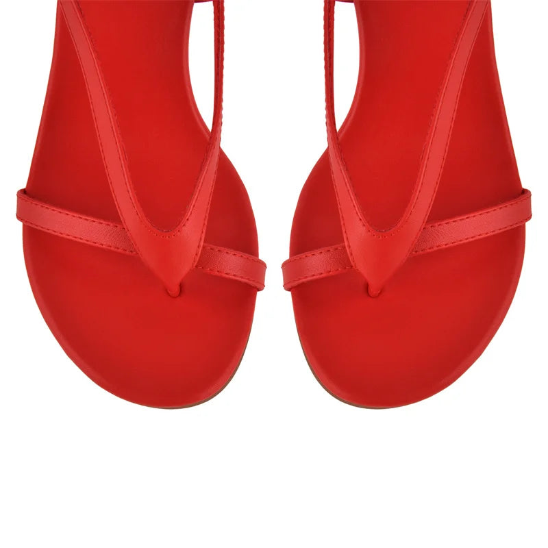 Close-up of red lace-up wedge sandals toe