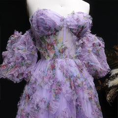 Floral dress with ruffled sleeves on a mannequin against a dark background