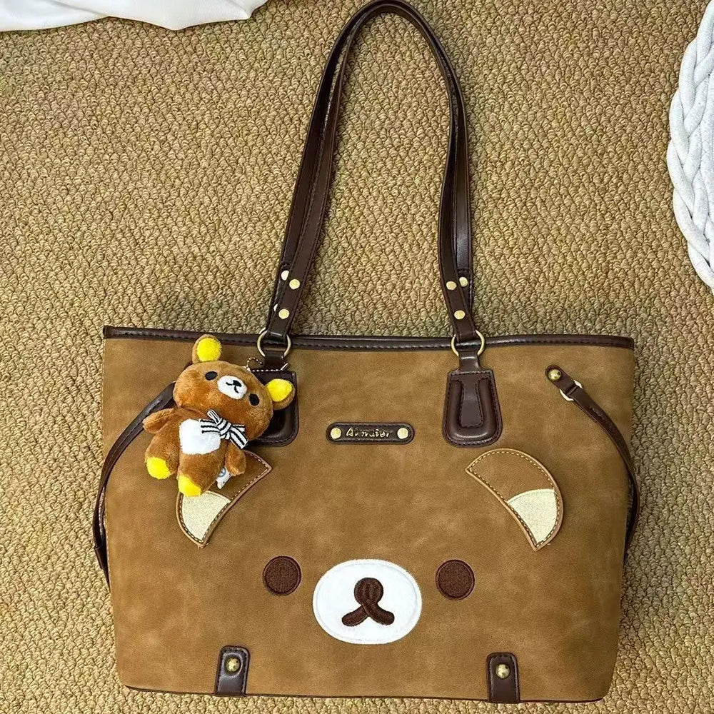 Close-up of brown bear applique tote bag with teddy bear charm