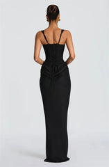 Black evening gown with thin straps on a white background