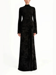 Black evening gown with long sleeves on a white background