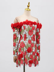 Mannequin wearing a floral dress with red flowers on a light gray background