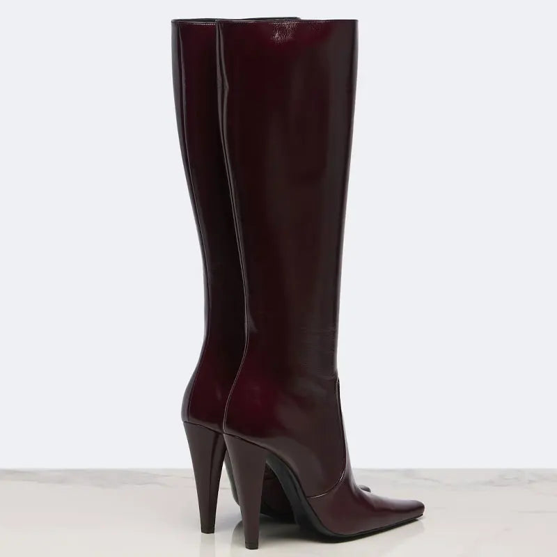 Back view of burgundy pointed slim high-heeled knee-high boots