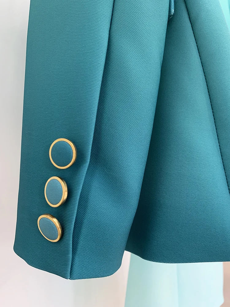 Close-up of gold-button detail on a gradient ombre blazer sleeve