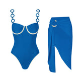 Blue bustier one-piece swimsuit with contrast trim and ring detail straps, paired with a matching wrap sarong.