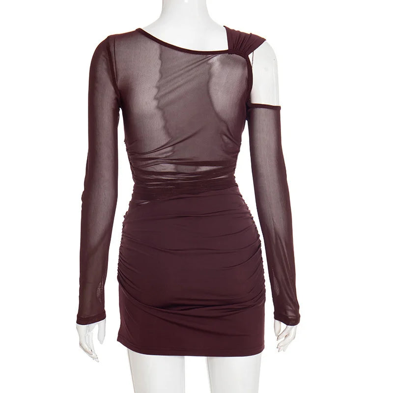 Mannequin wearing a burgundy dress with sheer long sleeves on a white background