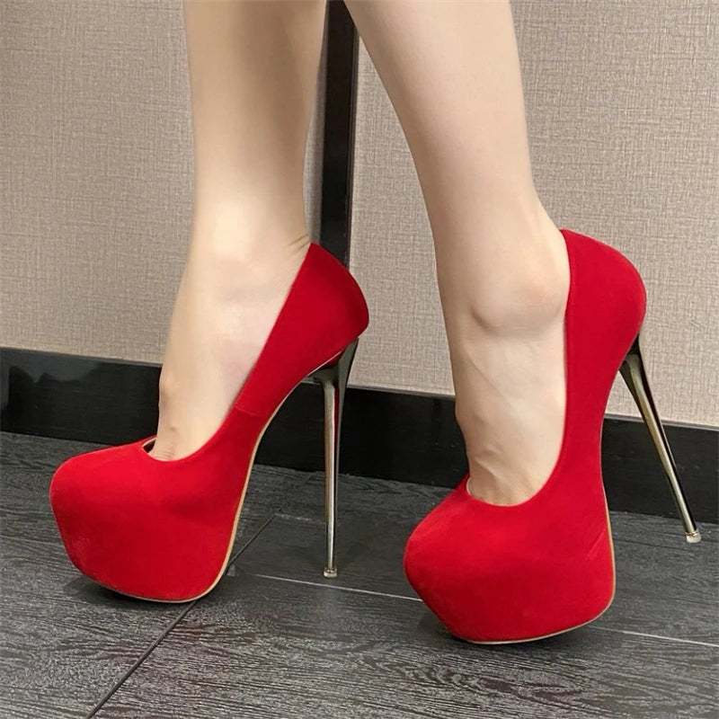Red high-heeled shoes on a neutral background