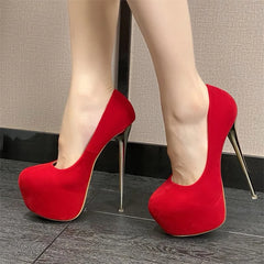 Red high-heeled shoes on a neutral background
