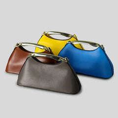 Collection of four trapezoid top handle bags in brown, gray, yellow, and blue