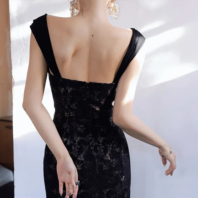 Black lace dress with a plunging neckline