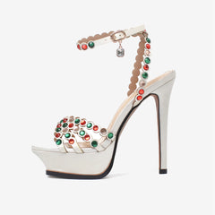 Platform crystal embellished stiletto heels in white satin with red and green crystals