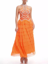Orange evening gown with intricate detailing on a white background