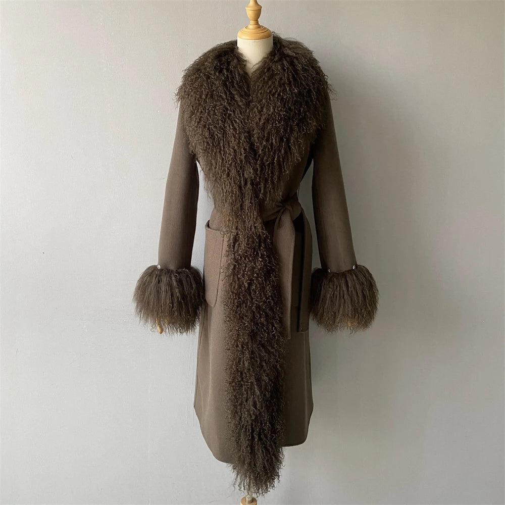 Brown coat with fur trim on a mannequin against a plain background