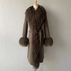 Brown coat with fur trim on a mannequin against a plain background
