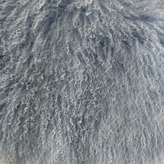 Close-up of wavy sand patterns on a beach