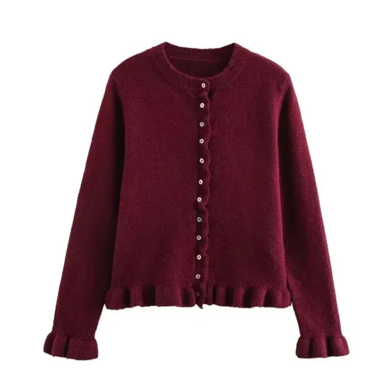 Maroon cardigan with button details on a white background