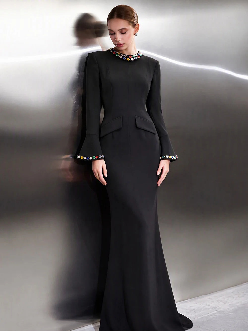 Black formal evening dress with crystal embellished neckline and flared sleeves