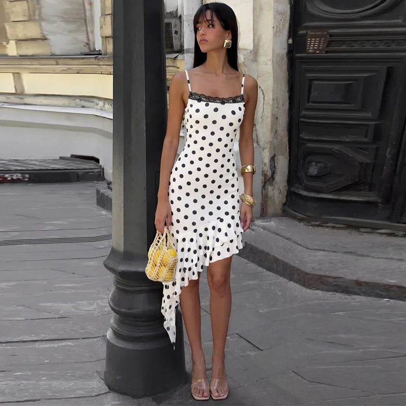 Close-up of polka dot lace trim asymmetric ruffle hem mini dress