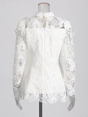 White lace blouse on a mannequin against a white background
