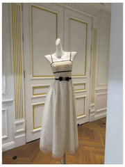 Strapless sequin midi dress displayed in an interior setting