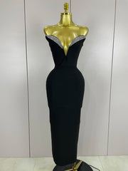 Black evening gown with beaded neckline on a mannequin against a plain background