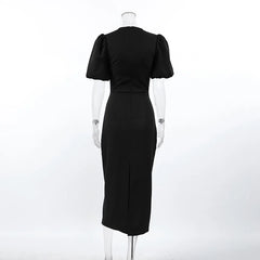 Black dress on a mannequin against a white background