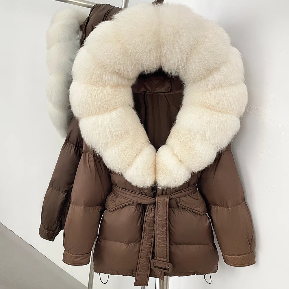Brown puffer jacket with a large white fur collar