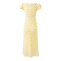 Back view of yellow floral print midi dress with square neckline and puff sleeves
