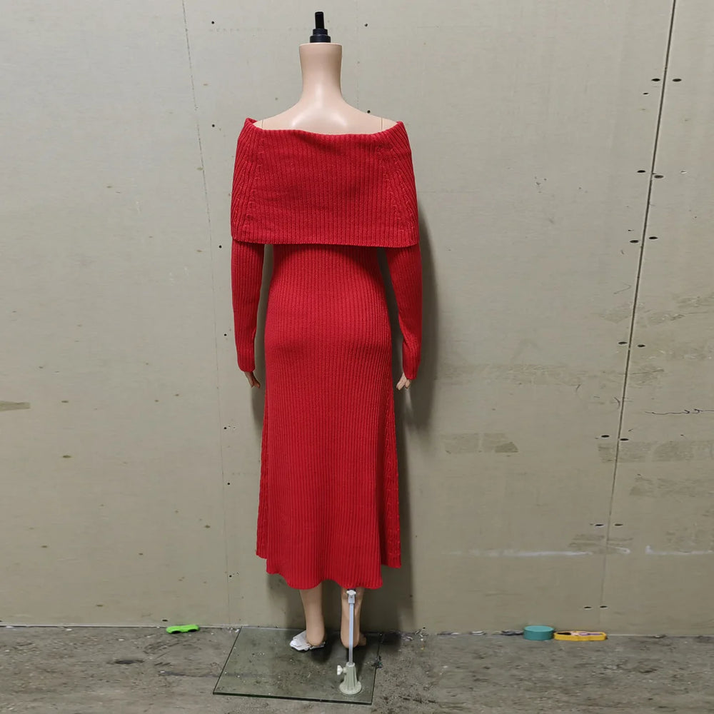 Red ribbed dress on a mannequin against a plain wall.