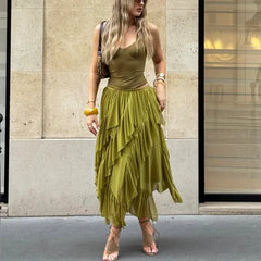 Person wearing flowing ruffled asymmetric hem maxi skirt