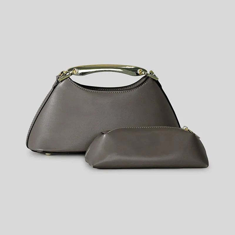 Gray trapezoid top handle bag with a separate matching pouch