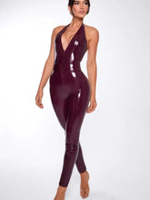 Woman wearing a shiny purple jumpsuit