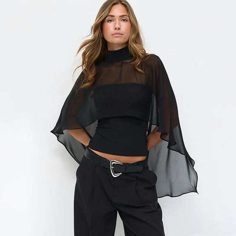 Back view of sheer cape overlay high neck top