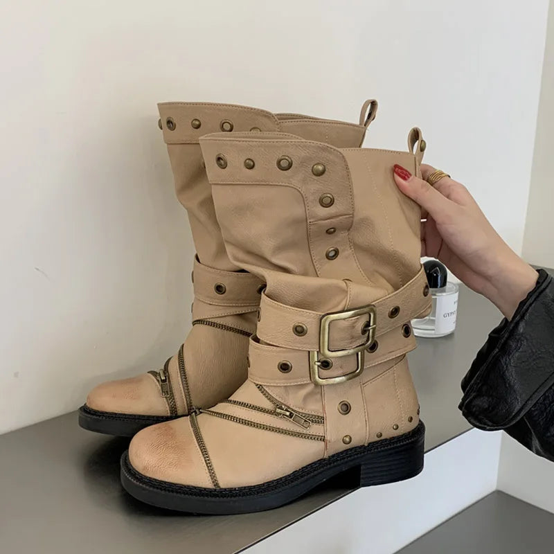 Beige studded ankle boots with buckle and zipper details