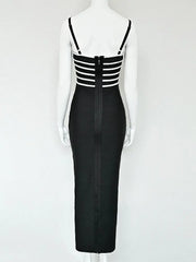 Black dress with white striped top on a mannequin against a white background
