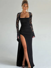 Black evening gown with lace sleeves on a plain background