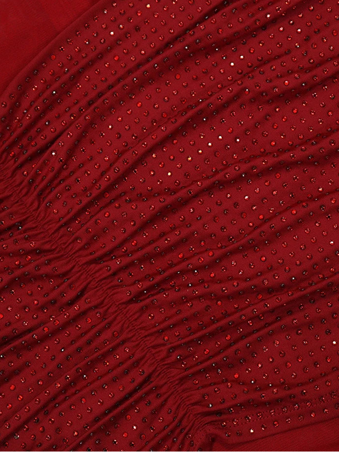 Red fabric with small embellishments