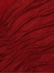 Red fabric with small embellishments