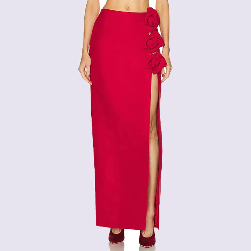 Full length view of a red maxi skirt with floral embellishments and a high slit