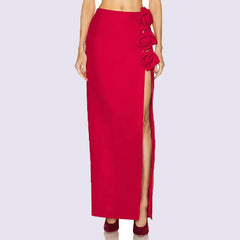 Full length view of a red maxi skirt with floral embellishments and a high slit